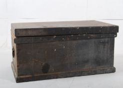 A large pine Victorian carpenters tool chest workbox with plinth base and cast iron handles having a