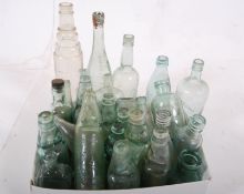 Two boxes of vintage glass bottles to include Esso Lube Oil amongst others. Tallest being 38cm.