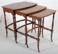 Edwardian mahogany nest of tables. Bamboo style shaped legs united by arched stretchers supporting