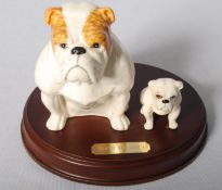 A Beswick Bulldog and pup on wooden plinth 'That's My Boy,' model number DA 222/3379; commissioned