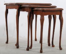 A Georgian style mahogany and leather graduating nest of tables. Cabriole legs with pad feet