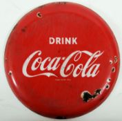 A vintage enamel Coca - Cola advertising sign. 40cm diameter