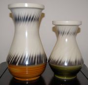Two Sylvac vases with lined design and mottled colouring One with a green base, the other brown.