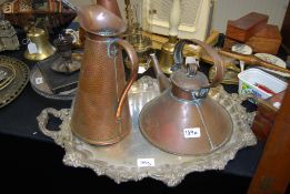 A 19th century Christopher Dresser style copper kettle together with a brass handbeaten ewer jug