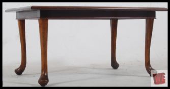 A solid mahogany mid 20th century coffee / occasional table. Cabriole legs with pad feet