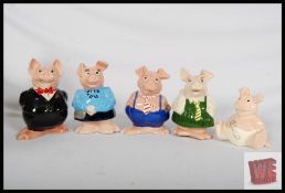 A set of 5 NatWest pigs in partial original wrappings.