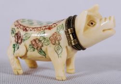 A 1960's Chinese snuff bottle in the form of a pig. The head on hinged brass bracket with chased red