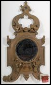 A Victorian Gilt Gesso Wood large rococo wall morror having scrolled form with central circular