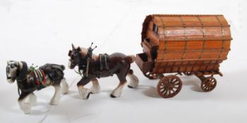 Two Sylvac style china Shirehorse figurines together with the matching wooden gypsy carriage.