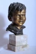 Cinque, Vicenzo, Italy 19th / 20th century. Large Bronze Bust of a young boy affixed to a marble