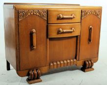 A 1930's Art Deco sideboard / dresser base. Decorative legs with end cupboards flanking a central