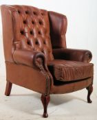A full grain brown leather Chesterfield / club armchair. Stood on cabriole legs with padded seat,