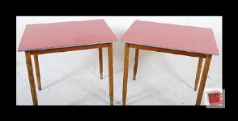 A pair of retro formica top side tables. Standing on beech tapered legs with red formica table
