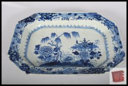 A large Chinese Quian Long (1736 - 1795) style period blue and white plate measuring 39.5cm x 28.