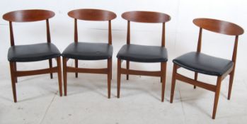 A set of 4 Danish teak wood dining chairs. Turned legs with high peripheral stretchers supporting