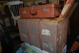 An early 20th century canvas and wooden bound Travel Trunk together with a vintage leather suitcase.