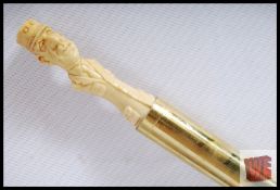 A French walking cane with carved handle in the form of General De Gaulle