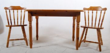 A contemporary pine country style dining table together with the 2 matching chairs. 105cms Wide x