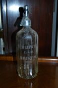 A vintage soda syphon with etching for 'Alderwick & Co, Bristol.' With makers stamp for the