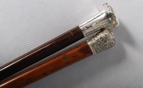 A pair of silver topped walking canes. One with a Malacca shaft, the other made by Kendall of London