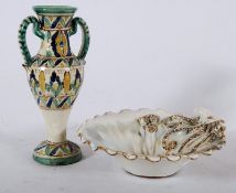 An unusual continental Majolica bowl having cream glaze with Octopus embellished side together