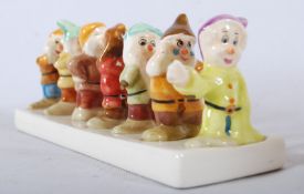 A Walt Disney Classics Snow White and the Seven Dwarfs` china toast rack, distributed by Clover.