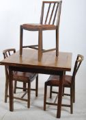 A 1930's Art Deco oak draw leaf dining table together with the 3 matching dining chairs. Utility