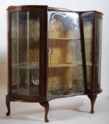 1930'a Art Deco burr walnut inverse breakfront display cabinet. Cabriole legs with pad feet