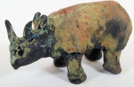 A 19th Chinese stone black rhino figurine of rustic form.