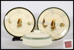 A pair of Royal Doulton 'Still Waters' pattern plates showing sailing boats, along with an Art
