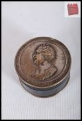 An ebonised wooden snuff box with inset commemorative coin to lid and base for Charles Fox. 3cm