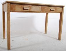 A 1930's Oak Air Ministry school desk. Solid oak construction with square legs supporting 2