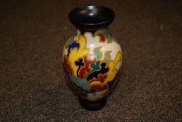 A Regina Gouda, Holland, vase with bold decoration, markings to base and measuring 19cm tall