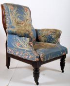 William IV mahogany club / library armchair. The fluted tapered legs supporting a serpentine