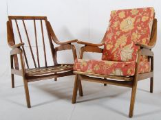 A pair of 1960's beech wood arm chairs in a Danish style with bentwood arms and solid wood frame.