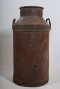 2 vintage early 20th century milk churns, one with lid being later painted with notation for Cadbury