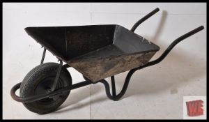 An original pressed metal GWR railway wheelbarrow having original wheel. Originally painted and