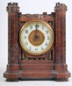 A 1920`s Junghans oak cased castle clock. The enamel face with brass bezel and brass movement