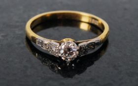 An 18ct gold and diamond ring, approx 55 points. The shank set with square paves of diamonds that