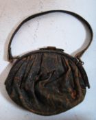 A vintage ladies leather evening handbag with decorative silk lining and a brass clasp to top. 14cm