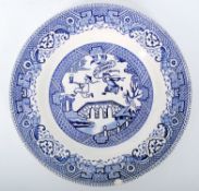 A blue and white transfer decorated China Craft side plate in the Willow pattern style with