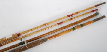 Two 6ft split cane fishing rods, one with burnt bamboo, the other having part ceramic eye pieces.