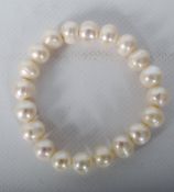 A white large freshwater pearl bracelet.