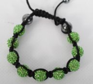 A Shambala bracelet in green and black colouring