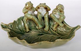 A Majolica style leaf dish with three frogs sat on the rim. 13cm x 28cm.