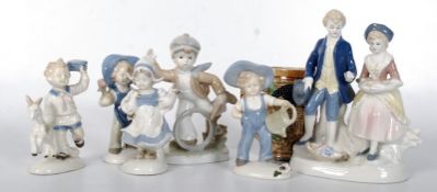 A collection of glazed continental bisque figurines (6 in total) together with a small German beer