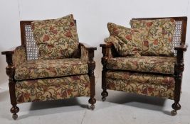A 1920`s solid oak Arts & Crafts Bergere sofa settee and 2 armchairs. The bell shaped legs having