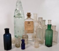 A collection of vintage glass bottles to include hand blown, mineral bottles etc