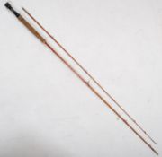 An Allcocks `Leander` split cane fly fishing rod. 8 and 3/4`` in length.