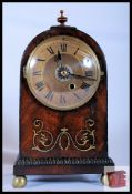 A mahogany inlaid bracket clock with a domed top and 8 day chain driven fusee movement. 36cm tall.